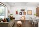 Stylish living room and dining area with modern furniture, artwork, and a bright ambiance at 1718 W 33Rd Ave, Denver, CO 80211