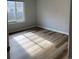 Bright and airy bedroom with vinyl flooring and large windows at 9725 E Harvard Ave # 346, Denver, CO 80231