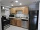 Updated kitchen with stainless steel appliances and light wood cabinetry at 9725 E Harvard Ave # 346, Denver, CO 80231