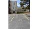Assigned parking spot #103 is painted in yellow in front of the building at 9725 E Harvard Ave # 346, Denver, CO 80231