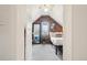 Unique attic bedroom features exposed brick, a comfy bed, and a stylish full-length mirror at 953 Kalamath St, Denver, CO 80204