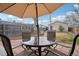 Backyard patio with dining set, umbrella, and a clear view of the yard at 953 Kalamath St, Denver, CO 80204