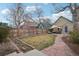 Fenced backyard with lawn, stone path and a covered patio at 953 Kalamath St, Denver, CO 80204