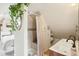 Bright bathroom with double sinks, tiled shower with bench, and leafy plants at 953 Kalamath St, Denver, CO 80204