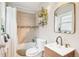 Well-lit bathroom features a shower-tub combo with neutral tile and a modern vanity at 953 Kalamath St, Denver, CO 80204