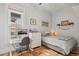 Cozy bedroom featuring a work area, stylish decor, and hardwood floors at 953 Kalamath St, Denver, CO 80204