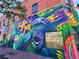 Building exterior with vibrant mural featuring a gorilla, showcasing a local art scene and community expression at 953 Kalamath St, Denver, CO 80204