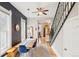 Charming dining room with a wood table, blue velvet chairs, and a stylish accent wall at 953 Kalamath St, Denver, CO 80204
