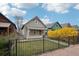 Charming bungalow-style home featuring a cozy front porch and fresh exterior paint with craftsman details and vibrant landscaping at 953 Kalamath St, Denver, CO 80204