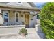 Charming front porch with a cozy seating area and decorative flower pot at 953 Kalamath St, Denver, CO 80204