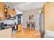 Bright kitchen featuring modern appliances, warm wood cabinetry, and a cozy breakfast nook at 953 Kalamath St, Denver, CO 80204