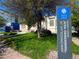 Exterior of the John Emhoolah, Jr. Branch Library, Denver Public Library, with lawn and a sign at 953 Kalamath St, Denver, CO 80204