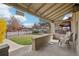 Relaxing front porch features classic railings and an inviting seating area, ideal for enjoying the neighborhood view at 953 Kalamath St, Denver, CO 80204