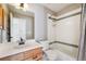 Bathroom with tub and shower combination and oak vanity at 2120 Pintail Dr, Longmont, CO 80504