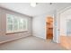 Bedroom with neutral walls, carpet and a door that leads to a walk-in closet at 2120 Pintail Dr, Longmont, CO 80504