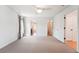 Spacious bedroom with neutral carpet, ceiling fan and multiple access doors at 2120 Pintail Dr, Longmont, CO 80504