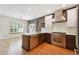 Eat-in kitchen with stainless appliances, marble countertop island, and a sunlit dining nook at 2120 Pintail Dr, Longmont, CO 80504