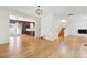 Open-concept living area with hardwood floors seamlessly flowing into the kitchen and dining areas at 2120 Pintail Dr, Longmont, CO 80504