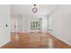 Bright living room boasting hardwood floors, a modern light fixture, and plenty of natural light at 2120 Pintail Dr, Longmont, CO 80504
