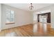 Open-concept living room with hardwood floors and large windows at 2120 Pintail Dr, Longmont, CO 80504