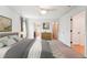 Bright main bedroom with ceiling fan, and ensuite bathroom at 2120 Pintail Dr, Longmont, CO 80504