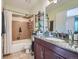 Bathroom featuring a shower-tub combo, granite vanity, and tile floors at 1057 Delta Dr # A, Lafayette, CO 80026