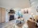 Cozy living room featuring a fireplace, hardwood floors, and ample natural light at 1057 Delta Dr # A, Lafayette, CO 80026