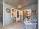 Inviting covered patio with corrugated metal ceiling and a quaint table setting, perfect for outdoor relaxation at 1057 Delta Dr # A, Lafayette, CO 80026