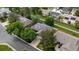 Aerial view of home with solar panels on roof, mature landscaping, and well-maintained lawn in a suburban neighborhood at 12277 W Chenango Dr, Morrison, CO 80465