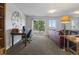 Finished basement with desk, sofa, sliding door to the exterior, and ample space at 12277 W Chenango Dr, Morrison, CO 80465