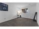 Bright, minimalist bedroom with a large window and simple decor, creating a serene and comfortable living space at 12277 W Chenango Dr, Morrison, CO 80465