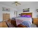 Cozy bedroom featuring a ceiling fan and soft, ambient lighting at 12277 W Chenango Dr, Morrison, CO 80465