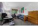 Cozy bedroom with a twin bed, large window, and decorative lights, creating a comfortable and inviting atmosphere at 12277 W Chenango Dr, Morrison, CO 80465