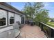 Inviting deck featuring a grill, rocking chair, and peaceful views of the surrounding landscape at 12277 W Chenango Dr, Morrison, CO 80465