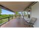 Covered deck with seating offering tranquil views and a peaceful place to relax at 12277 W Chenango Dr, Morrison, CO 80465