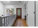 Bright entryway featuring hardwood floors, a decorative front door, and a staircase with a railing at 12277 W Chenango Dr, Morrison, CO 80465