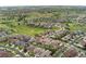 Aerial view of a neighborhood with a green space featuring homes, streets, and amenities nearby at 21962 E Idyllwilde Dr, Parker, CO 80138