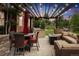 Outdoor living space includes kitchen, dining area, and a cozy fire pit for entertaining guests at 21962 E Idyllwilde Dr, Parker, CO 80138