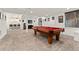 Finished basement with a pool table, bar area, and carpeted floors offers versatile entertainment space at 21962 E Idyllwilde Dr, Parker, CO 80138
