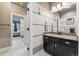Stylish bathroom vanity with dark cabinetry, light granite countertop, and modern fixtures at 21962 E Idyllwilde Dr, Parker, CO 80138