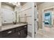 Neutral bathroom with granite vanity, a view to the turquoise bedroom at 21962 E Idyllwilde Dr, Parker, CO 80138