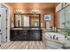 Elegant bathroom features a double vanity, soaking tub, and stylish tile work at 21962 E Idyllwilde Dr, Parker, CO 80138