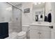 Modern bathroom with glass shower, vanity, and neutral color scheme offers a relaxing retreat at 21962 E Idyllwilde Dr, Parker, CO 80138