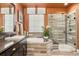 Modern bathroom featuring a standalone tub, frameless glass shower, and warm color scheme at 21962 E Idyllwilde Dr, Parker, CO 80138