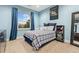 Bedroom features a blue plaid comforter and ample natural light from the window at 21962 E Idyllwilde Dr, Parker, CO 80138