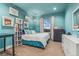 Stylish bedroom with bright teal walls, white trim, and large window at 21962 E Idyllwilde Dr, Parker, CO 80138