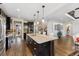 Gourmet kitchen showcasing a central island, stainless steel appliances, and an open layout at 21962 E Idyllwilde Dr, Parker, CO 80138