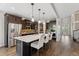 Well-equipped kitchen with stainless appliances, granite countertops, and a breakfast bar island at 21962 E Idyllwilde Dr, Parker, CO 80138