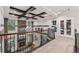 Beautiful loft area with stone fireplace, coffered ceiling, and built-in storage at 21962 E Idyllwilde Dr, Parker, CO 80138