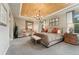 Spacious main bedroom featuring a wood plank ceiling, carpeted floors, and lots of natural light at 21962 E Idyllwilde Dr, Parker, CO 80138